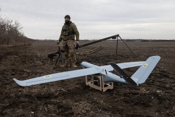 A Ukrainian soldier from the "Brodyahy" unit prepares to launch a GOR reconnaissance drone near Pokrovsk, March 10, 2025. (Source: Getty Images)