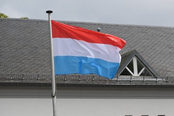 The flag of Luxembourg flies in the wind. (Source: Getty Images)