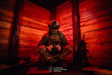 A Ukrainian drone operator from the 41st Mechanized Brigade inside a red-lit dugout. (Source: 41st Mechanized Brigade)