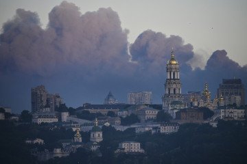 Smoke rises over Kyiv during a Russian missile and drone attack on the Ukrainian capital on May 24, 2026. (Source: Getty Images)