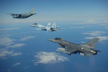 Portuguese F-16 near Russian Su-35 fighter and An-12 transport airplane over the Baltic Sea, May 6, 2026. (Source: NATO Allied Air Command﻿)