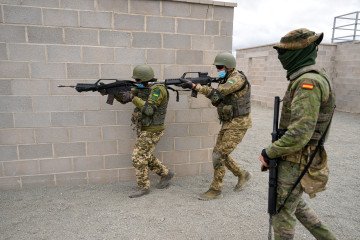 Armed Ukrainian military personnel take part in an urban warfare exercise, conducted by the Spanish military, at the Toledo infantry academy in Toledo, Spain, on March 24, 2023. (Source: Getty Images)