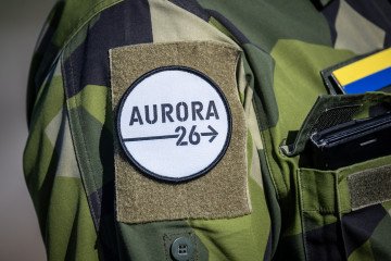 The Aurora emblem with the exercise flag in yellow and blue colors on the arm of a Swedish soldier during a press day for the military exercise Aurora 26 at the Revingehed training field in Skåne, Southern Sweden, on April 29, 2026. (Source: Getty Images)