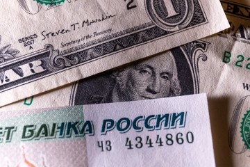 Russian rouble notes are seen besides one dollar bill notes on January 11, 2025 in Bath, England. Illustrative photo. (Source: Getty Images)