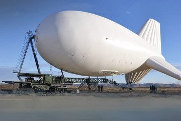 A large surveillance aerostat used for aerial monitoring and intelligence gathering, deployed from a mobile ground platform. (Photo: CCD)