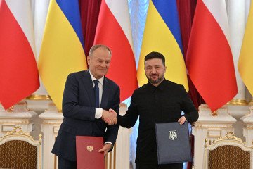 Ukrainian President Volodymyr Zelensky (R) and Poland’s Prime Minister Donald Tusk (shake hands after a document signing ceremony at the Mariinskyi Palace in Kyiv on February 5, 2026. (Source: Getty Images) Ukrainian President Volodymyr Zelensky (R) and Poland’s Prime Minister Donald Tusk (shake hands after a document signing ceremony at the Mariinskyi Palace in Kyiv on February 5, 2026. (Source: Getty Images)