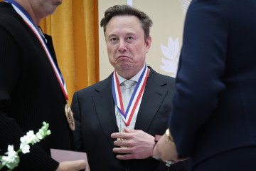 Tesla and SpaceX CEO Elon Musk reacts after being awarded the National Medal of Science during the Golden Age of American Innovation Summit at the Institute of Peace on October 08, 2026, in Washington, DC. (Source: Getty Images) Tesla and SpaceX CEO Elon Musk reacts after being awarded the National Medal of Science during the Golden Age of American Innovation Summit at the Institute of Peace on October 08, 2026, in Washington, DC. (Source: Getty Images)