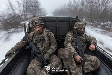 Ukrainian soldiers ride in the back of a military truck. (Source: 93rd Mechanized Brigade)