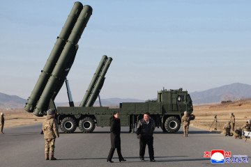 Kim Jong Un and his daughter Kim Ju Ae observe a test of a large-caliber rocket launcher at an undisclosed location in North Korea, January 27, 2026. (Source: Getty Images)