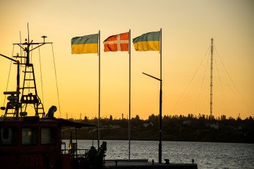 The flags of Ukraine and Denmark flutter against the background of the sunset on September 9, 2023, in Mykolaiv, Ukraine. The flags of Ukraine and Denmark flutter against the background of the sunset on September 9, 2023, in Mykolaiv, Ukraine.