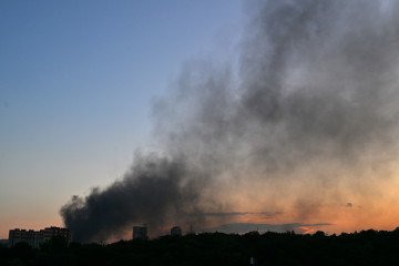 Illustrative image. Smoke rising at sunset following a drone strike in Kyiv, on August 20, 2026.