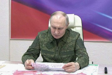 A screen grab from a video shows Russian leader Vladimir Putin, dressed in military uniform, visiting a command post in Kursk, Russia, on March 12, 2025. (Source: Getty Images)
