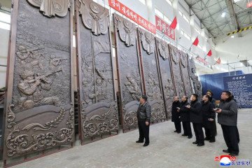 Kim Jong Un inspects towering bronze reliefs depicting battlefield scenes, intended for North Korea’s new overseas war memorial. (Photo: KCNA)
