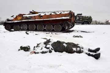 The body of a Russian serviceman lies near destroyed Russian military vehicles on the outskirts of Kharkiv, February 26, 2022. (Photo: Getty Images) The body of a Russian serviceman lies near destroyed Russian military vehicles on the outskirts of Kharkiv, February 26, 2022. (Photo: Getty Images)
