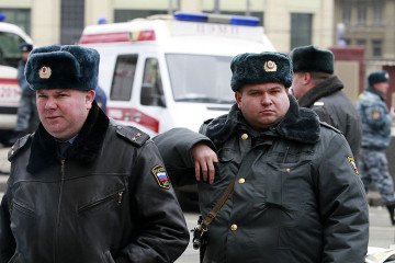 Russian policemen are seen in front of the Lubyanka metro station entrance on March 29, 2010 in Moscow, Russia. (Source: Getty Images)