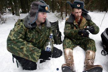 Russian Forces Suffer Mass Alcohol Poisoning in Zaporizhzhia Direction, Ukraine Reports Russian men in army officer's uniform drink vodka on February 14, 2010 in a forest near Radishchevo villiage, Russia. Illustrative photo. (Source: Getty Images)