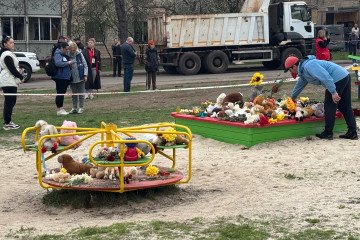 People leave flowers and toys at a playground where people were killed after a Russian missile attack on April 5, 2025 in Kryvyi Rih, Ukraine. (Source: Getty Images)