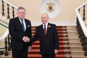 Russian leader Vladimir Putin greets Slovak Prime Minister Robert Fico at the Kremlin ahead of the Victory Day parade in Moscow on May 9, 2026. (Source: Getty Images)