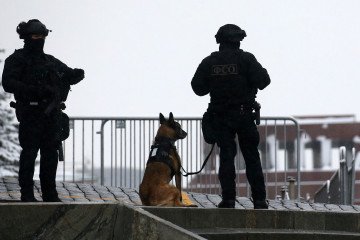 Russian Federal Protective Service (FSO) officers with a sniffer dog stand on duty during National Unity Day, November 4, 2024. (Photo: Getty Images)