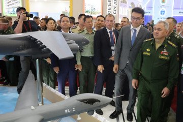 Russian Defense Minister Sergei Shoigu examines Chinese military aircraft models during the Army 2023 International Military-Technical Forum at Patriot Park in Kubinka, west of Moscow, on August 14, 2023. (Photo: Getty Images)