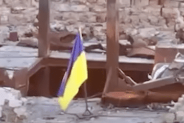 A Ukrainian flag flies over a building on the Kinburn Spit after Ukrainian forces reported driving Russian troops from several positions during a fire strike. (Photo: Regional Command of Ukraine’s Territorial Defense Forces “South”/Facebook)