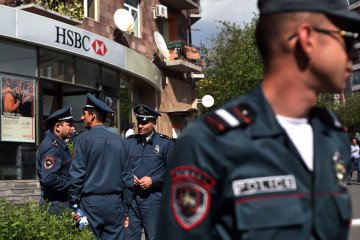 Armenian police officers secure the cordoned-off area following an armed bank robbery attempt in an HSBC bank branch in Yerevan on May 3, 2018. (Source: Getty Images)