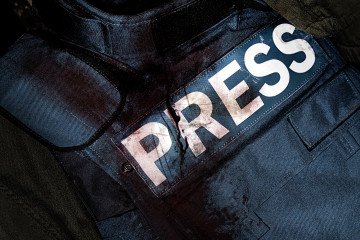 Press journalist armor war protective vest in blood. Illustrative photo. (Source: Getty Images)