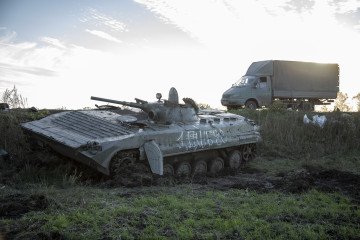 A Ukrainian military vehicle drives by a Russian military armored vehicle left aside a road in the frontline near Druzhelyubivka city, Kharkiv region, Ukraine, October 8th, 2022. (Source: Getty Images) A Ukrainian military vehicle drives by a Russian military armored vehicle left aside a road in the frontline near Druzhelyubivka city, Kharkiv region, Ukraine, October 8th, 2022. (Source: Getty Images)