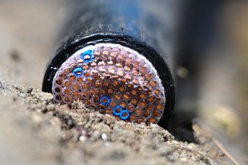 Illustrative image. Cables lie in a cable duct at the construction site for the general renovation of the railroad line between Hamburg and Berlin on August 20, 2025, Brandenburg, Falkensee, Germany. (Source: Getty Images)