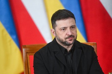 Polish Prime Minister, Donald Tusk (not sen) and the President of Ukraine, Volodymyr Zelenskyy reacts during a welcome at the Prime Minister's Chancellery on December 19, 2025 in Warsaw, Poland. (Source: Getty Images)
