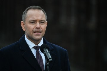 Polish President Karol Nawrocki addresses the media outside Block 11 at the former Auschwitz I camp on January 27, 2026, in Oswiecim, Poland. (Source: Getty Images)