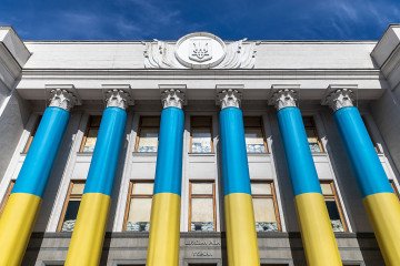 The Verkhovna Rada of Ukraine building is seen featuring sandbags placed behind windows and with the facade decorated in the colours of the Ukrainian flag. (Source: Getty Images) The Verkhovna Rada of Ukraine building is seen featuring sandbags placed behind windows and with the facade decorated in the colours of the Ukrainian flag. (Source: Getty Images)