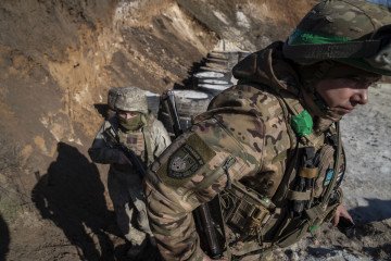 Infantry soldiers of the 93rd Brigade prepare for combat medical training before deployment to the front lines in an unknown location in Donetsk Oblast, Ukraine, on March 10, 2026. (Source: Getty Images)
