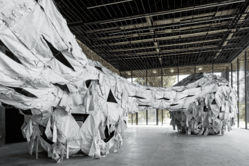 Ai Weiwei’s installation Three Perfectly Proportioned Spheres and Camouflage Uniforms Painted White at Pavilion 13 in Kyiv. (Source: Ai Weiwei/Instagram) Ai Weiwei’s installation Three Perfectly Proportioned Spheres and Camouflage Uniforms Painted White at Pavilion 13 in Kyiv. (Source: Ai Weiwei/Instagram)