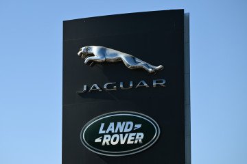 The Jaguar and Land Rover logos are displayed outside a Jaguar dealership in Edmonton, Alberta, Canada, on March 22, 2025. (Source: Getty Images)