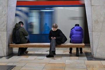 Russia Ranked Second Worst in World for Internet Freedom—Only North Korea Scores Lower People use their smartphones while sitting on a bench at a metro station in Moscow on February 12, 2026. (Source: Getty Images)