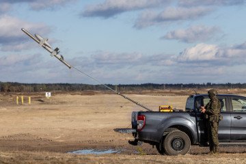 A Polish soldier operates a MEROPS interceptor drone during tests in Nowa Deba, Poland, November 18, 2025. (Source: Getty Images)