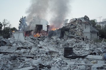 35,000 Foreign-Made Components Identified in Russian Missiles and Drones Used in Latest Kyiv Strike A firefighter searches through heavy structural debris inside a damaged apartment building to locate trapped residents. (Source: Lucile Brizard/UNITED24 Media)