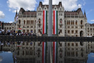 Hungary's parliament building decorated with Hungarian flags. (Source: Getty Images)