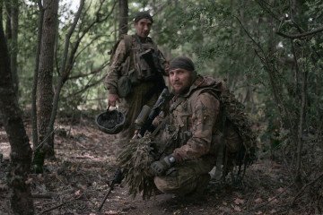 Ukrainian infantrymen of the 47th Separate Mechanized Brigade head for rotation after leaving their forward positions on August 28, 2026, in the Sumy region, Ukraine.