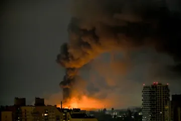 A plume of thick black smoke rises from a fire following a Russian missile attack in Kyiv, Ukraine, on August 1, 2026. (Source: Getty Images)