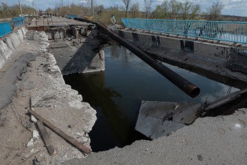 A shell-damaged bridge over a river is seen on April 7, 2024, in Kupiansk, Ukraine.