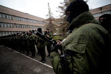 Russia’s War Unleashes Surge in Sexual Violence and Murder by Its Own Soldiers Russian forces stand before their swearing-in ceremony in the Republican military enlistment complex in Simferopol on March 10, 2014. Illustrative photo. (Source: Getty Images)