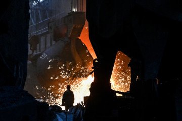 An employee works in an open-hearth furnace shop at Zaporizhstal PJSC in Zaporizhzhia, Ukraine. (Source: Getty Images)