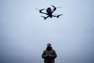A drone operator controls the flight of a drone against a cloudy sky, showcasing the precision and technology behind modern UAV systems. (Photo: General Chereshnya)