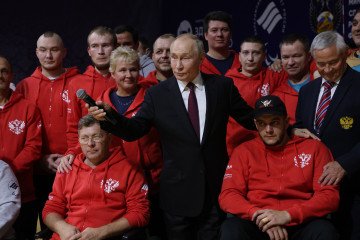 Russian leader Vladimir Putin poses for a group photo with Paralympic athletes who became disabled due to their participation in the war against Ukraine, October 17, 2024, in Ufa, Russia. (Source: Getty Images)