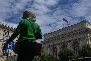 A woman walks by as an exterior view of the Central Bank of the Russia building in Moscow, Russia on June 19, 2026. (Source: Getty Images)