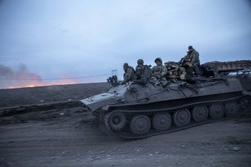 Ukrainian servicemen are seen on top of an armored carrier returning from the Semenivka battlefield near Avdiivka, Ukraine, March 4, 2024. (Source: Getty Images) Ukrainian servicemen are seen on top of an armored carrier returning from the Semenivka battlefield near Avdiivka, Ukraine, March 4, 2024. (Source: Getty Images)
