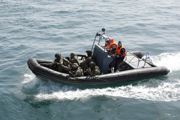 Naval units from Iran and Russia carry out to simulation of rescue a hijacked vessel during the joint naval drills held at the Port of Bandar Abbas near the Strait of Hormuz in Hormozgan, Iran on February 19, 2026. Illustrative photo. (Source: Getty Image
