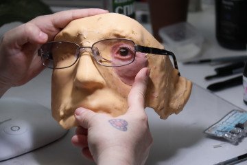 How Silicone Artistry Became a Lifeline for Rebuilding Faces and Identity Amid Russia’s War in Ukraine Taisiia Yarova demonstrates a custom facial prosthesis designed to attach to the skin and replicate the natural appearance of a missing part of the face. (Source: Getty Images)
